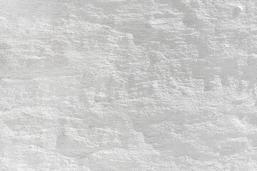Naklejka premium Embossed textured white grunge wall surface painted with whitewash could be used like a layout or background.
