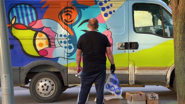 international artist day.graffiti artist observing how his drawing has turned out