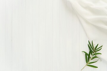 Minimal aesthetic wedding background with white fabric and green branch, space for text or product, styled stock photography.