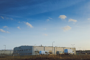 Fototapeta na wymiar Modern industrial building over blue sky