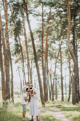 Fototapeta premium Family with baby daughter and little son in park