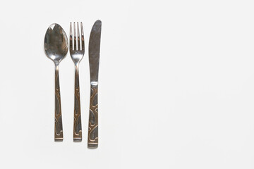 Restaurant eating items - Fork, spoon and knife on white background