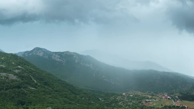 Dark clouds and rain with thunderstorm in Njegusi, Montenegro. Timelapse 4K.