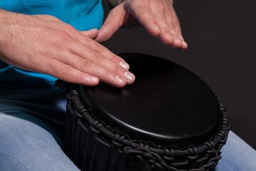 Man Playing the African Djembe Drum