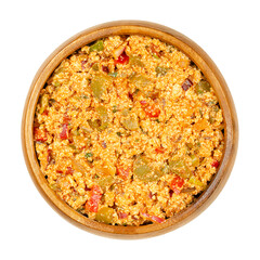 Vegan Liptauer bread spread, in a wooden bowl. Spicy spread, made of crumbled white tofu, red peppers, gherkins, onions and spices. Savory traditional Austrian-Hungarian cuisine. Close-up, from above.