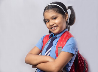 Smiling girl child in school uniform
