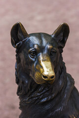 Bronze sculpture of a dog.