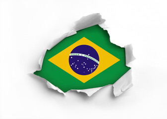 Flag of Brazil underneath the ripped paper