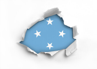 Flag of Federated States of Micronesia underneath the ripped paper