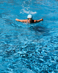 Young woman training at the swimming pool