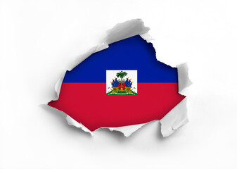 Flag of Haiti underneath the ripped paper