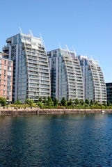 Fototapeta na wymiar Curved residential buildings overlooking Huron Basin from the waterside of North Wharf in Greater Manchester, England, UK