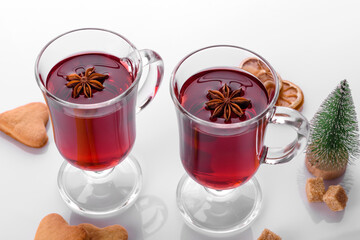Hot red mulled wine isolated on white background with christmas spices