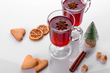 Hot red mulled wine isolated on white background with christmas spices
