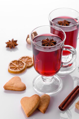 Hot red mulled wine isolated on white background with christmas spices