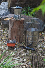 Fototapeta premium Pinto name of camping pot for cooking with moka pot coffee maker on a mountain day.
