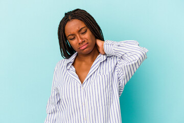 Fototapeta premium Young african american woman isolated on blue background having a neck pain due to stress, massaging and touching it with hand.