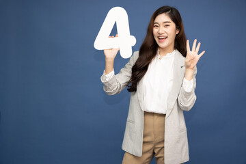 Young Asian business woman showing number 4 or four isolated on deep blue background