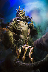 Decoration for Halloween and other parties, Statue of a strong muscular majestic handsome king of the seas Poseidon with a beard crowned with a large golden trident  © Defree
