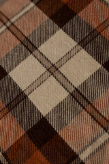 Close up of brown background of lumberjack plaid shirt