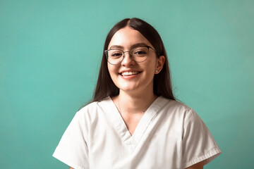 Fototapeta premium portrait of a young Latin American woman in a health suit. Hispanic doctor or nurse young woman education concept.