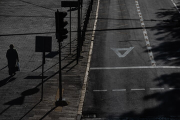 Horizontal high contrast morning shot of Lviv street with bus lane and pedestrian