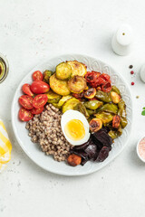 Egg buckwheat summer vegetables bowl. Space for text, top view.