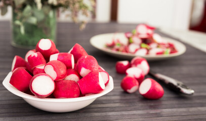 cooked crispy radish in white bowl on wooden table