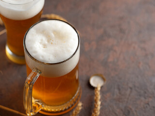 Two wheat beers on a brown copy space table
