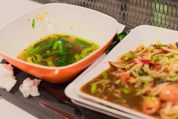 The food scraps on the plates are gathered on the table.