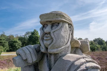 Fototapeten Detail of a statue of a Roman soldier at the only known example of a Roman marching camp in the Netherlands on Ermelose heide, Gelderland Province, The Netherlands © Holland-PhotostockNL