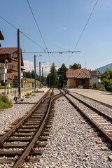 Fototapeta na wymiar Train tracks towards the station in the city center, Telfes Im Stubai, Tyrol, Austria