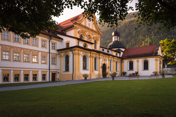 Fototapeta na wymiar Baroque Cistercian Stams Abbey (Stift Stams) in Stams at sunrise, Imst district, Tyrol, Austria