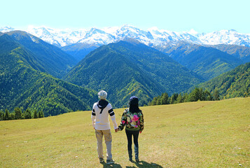Couple Enjoy the Amazing View of the Caucasus Mountain Ranges, Mestia, Svaneti Region, Georgia