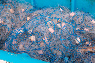fishing nets on a blue boat.