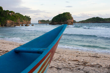 Fishing boat with beach background.