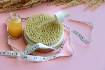 massage brush for anti-cellulite massage for weight loss, massage oil and a centimeter for measuring the waist