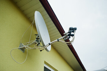 Satellite dish at home roof installed.