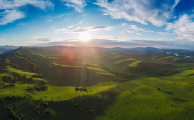 Fototapeta na wymiar Aerial Panorama drone shot of beauty dawn on the peak, in the mountains in Altay, summertime