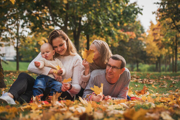 Fototapeta premium happy family on autumn picnic in park