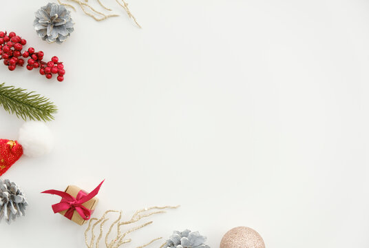 Directly Above Shot Of Christmas Decorations Over White Background