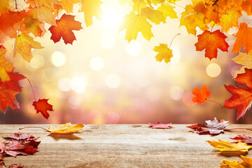 Naklejka na ściany i meble Wooden table top on blur autumn background