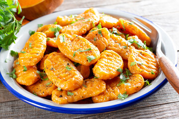 Delicious pumpkin gnocchi with olive oil, vegan food.