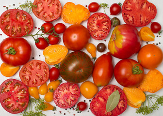 Tomatoes of different kind on white background.  Variety of colorfull tomatoes.