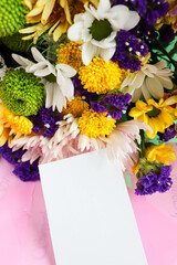 greeting card design. autumn bouquet. bouquet of multi-colored chrysanthemums on a white background and space for text. invitation. congratulation 