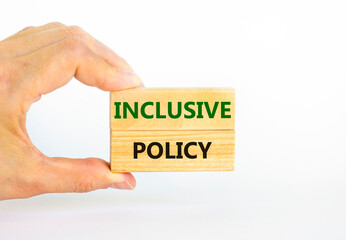 Inclusive policy symbol. Wooden blocks with words Inclusive policy on beautiful white background. Businessman hand. Business, HR and inclusive policy concept. Copy space.