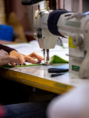 Foot, needle and thread in a sewing machine