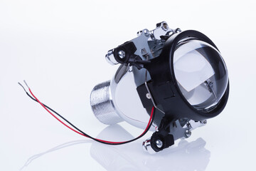Automotive headlamp lens bi-xenon. Isolate on white background © Cornel Putan