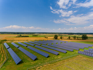 Photovoltaic farm - renewable energy from sunlight - photovoltaic panels set on a green field....