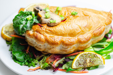 Steak and ale pasty, British steak with ale, potato and leek, wrapped in puff pastry